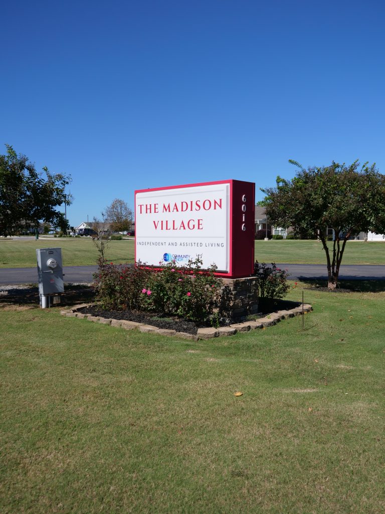 the outdoor sign for The Madison Village in Madison, AL