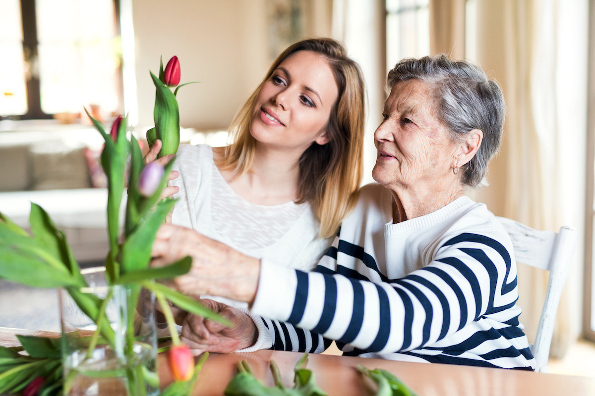 Elderly,Grandmother,With,An,Adult,Granddaughter,At,Home.
