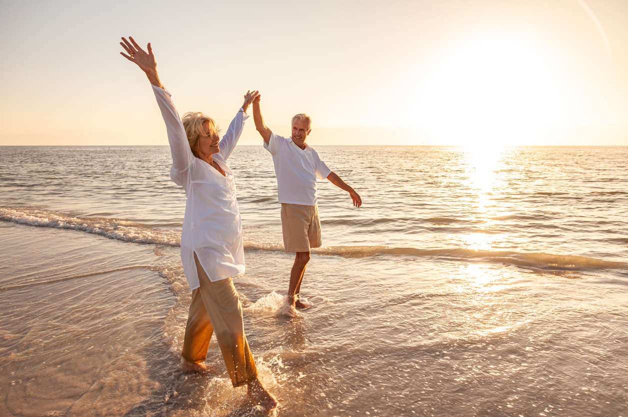 Active senior couple enjoying retirement outdoors thanks to independent living in Baldwin County, Alabama.