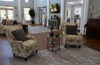 Seating area and view of the front entrance of The Madison Village in Madison, AL