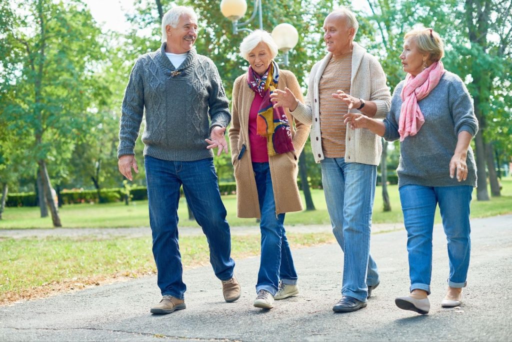 Older adults walking together in Gulf Shores, Alabama.