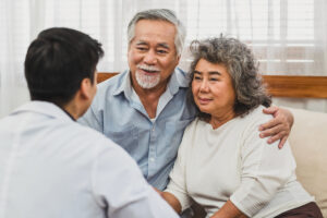 Doctor Consulting with Senior Couple_Community Senior Life